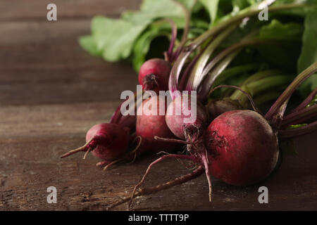 Bunch of young beets on wooden background Stock Photo