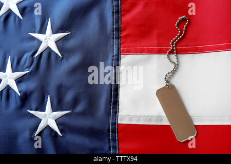 Soldier's token on American flag background Stock Photo