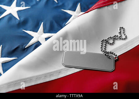 Soldier's token on American flag background Stock Photo