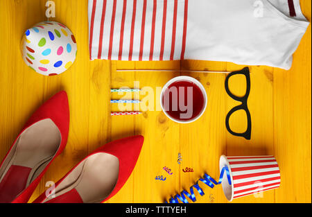 Party accessories on yellow wooden background Stock Photo
