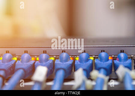 Information Technology Computer Network, Telecommunication Ethernet Cables Connected to Internet Switch. Stock Photo