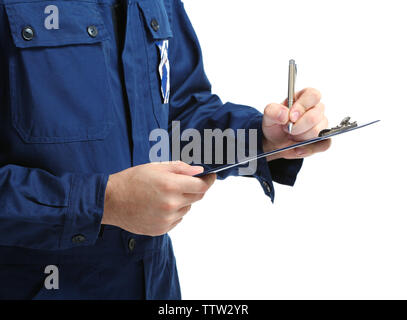 Mechanic in uniform with a clipboard and pen, close up Stock Photo