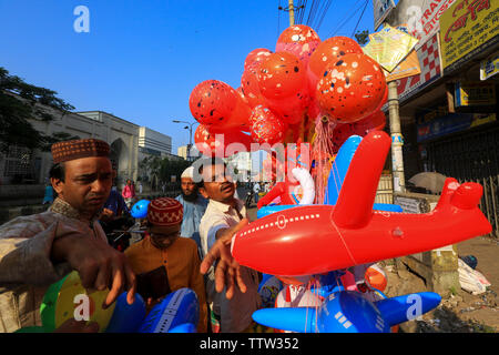 A street vendor sells balloons and plastic toy during the Eid-ul-Azha festival at Dhaka, Bangladesh. Stock Photo