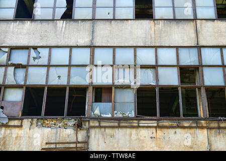 Old broken Windows in an abandoned factory. Horizontal photography Stock Photo