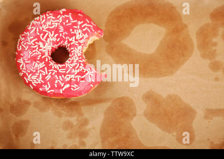 Delicious donut on greasy paper Stock Photo