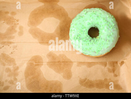 Delicious donut on greasy paper in box Stock Photo