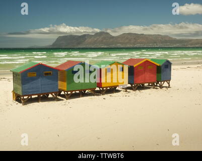 Muizenberg beach little colored huts on white sand bring happiness for vacations on summer