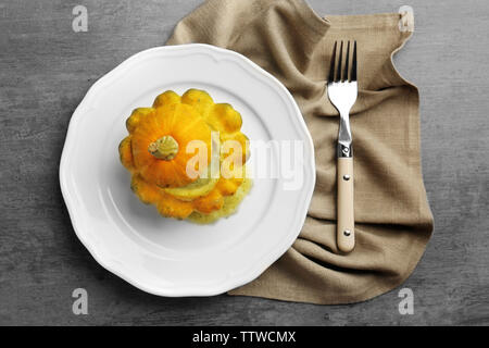 Baked pattypan squash served on white plate Stock Photo