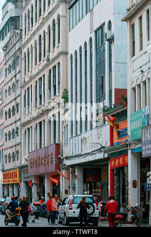 Haikou riding building sweeping the street Stock Photo
