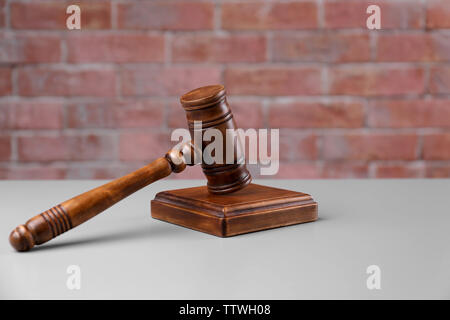 Gavel and sound block on brick wall background Stock Photo