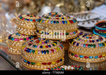 Colorful jewel boxes in Indian market on the street in Rishikesh, India. Close up. Stock Photo
