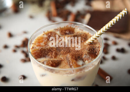 Delicious milkshake with chocolate in a glass on table, closeup Stock Photo