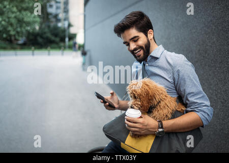 Handsome young man browsing the net during a coffee break. Stock Photo
