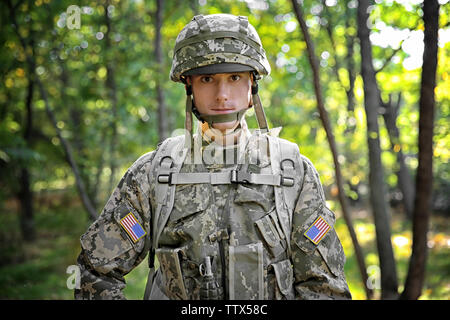 Portrait of soldier in green forest Stock Photo