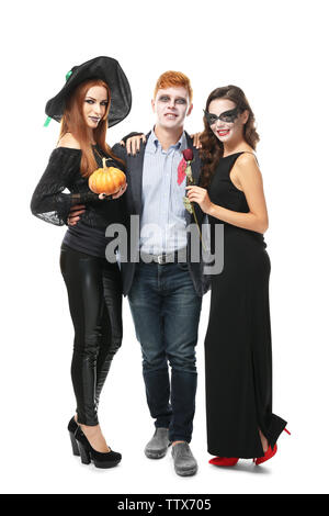 Young people dressed in different costumes for Halloween, isolated on white Stock Photo