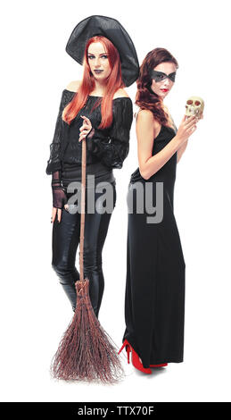 Young women dressed as witch and vampire for Halloween, isolated on white Stock Photo