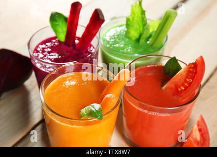 Glasses with fresh vegetable smoothie on wooden table Stock Photo