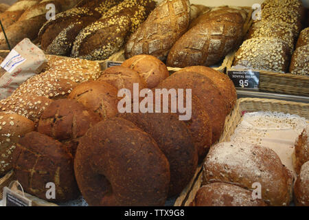 Donuts and  breads for sale in a bakery, Bangkok, Thailand Stock Photo