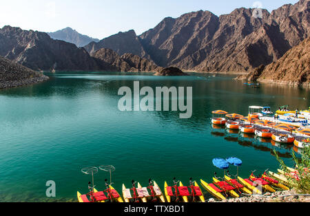 Beautiful Hatta Dam in Dubai place to enjoy weekends water adventure activities amazing mountain scenery of Hatta lake Stock Photo