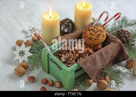 Green box with Christmas decoration on table Stock Photo