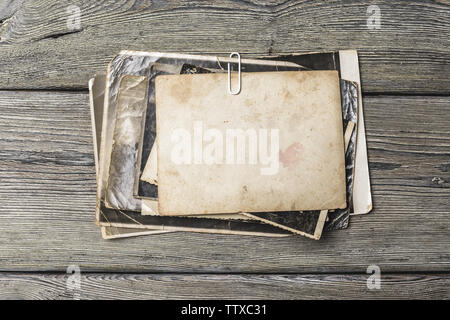 retro some old photos on wooden table Stock Photo