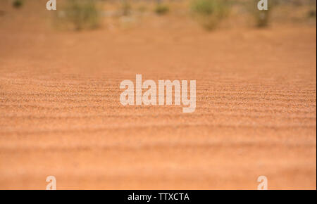 Closeup Shot of Desert Sand Dunes pattern beautiful orange shade desert sand texture background Stock Photo