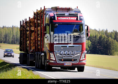 Humppila, Finland. May 31, 2019. Customised Volvo FH16 logging truck of Hannikainen hauls a log load in highway traffic in the summer. Stock Photo