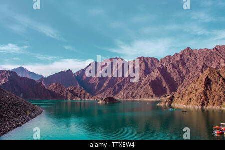 Hatta Dam in Dubai Beautiful scenery of mountain and lake famous tourist attraction of United Arab Emirates place for water adventure activities Stock Photo