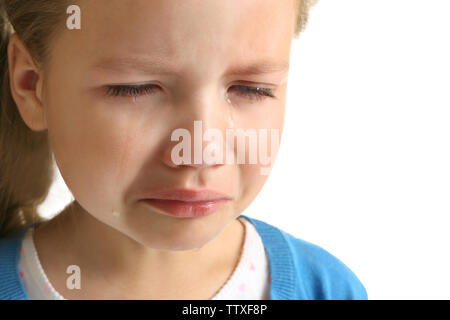 Portrait of crying little girl on white background, close up view Stock Photo