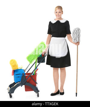 Beautiful chambermaid with cleaning equipment on white background Stock Photo