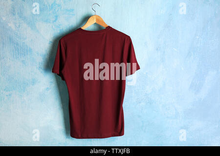 Blank maroon t-shirt on grunge background Stock Photo