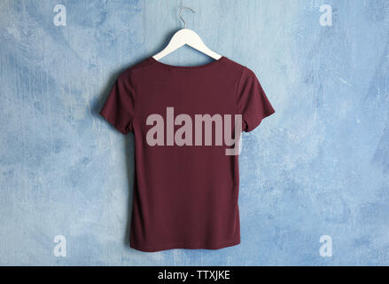 Blank maroon t-shirt on grunge background Stock Photo