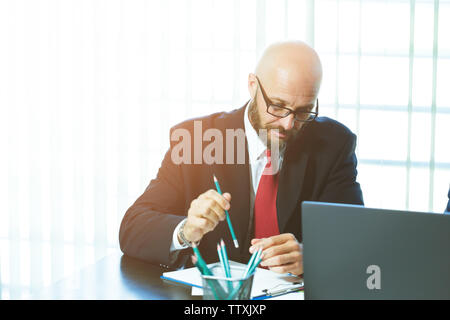 business man working with documents and laptop Stock Photo