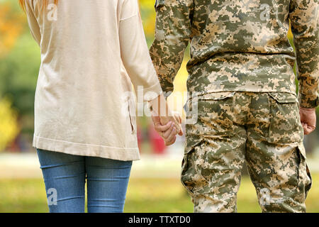 Soldier reunited with wife,  closeup Stock Photo