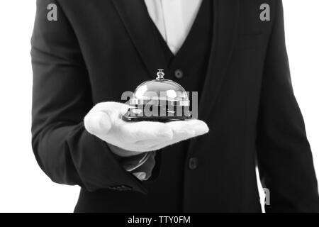 Male waiter holding bell on white background Stock Photo