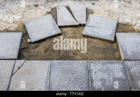Floor tiles mortar blocks unfinished on pathway Stock Photo