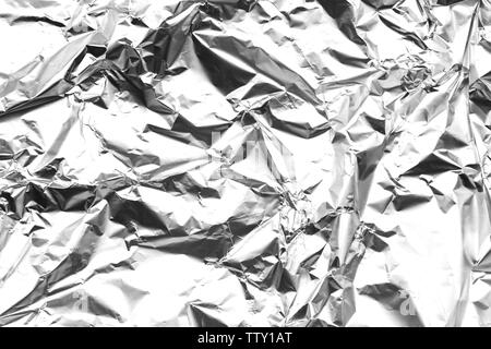 Abstract background made of textured aluminum foil. Stock Photo
