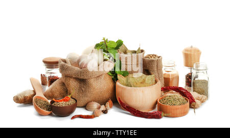 Spices in sacking bags on white background Stock Photo