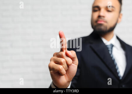 Business man touching an imaginary screen Stock Photo