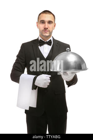 Handsome waiter holding serving tray with metal cloche and napkin on white background Stock Photo