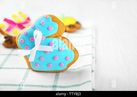 Creative rabbit shape Easter cookie on napkin, closeup Stock Photo