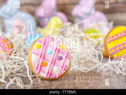 Creative Easter cookies and decorations on wooden table, closeup Stock Photo