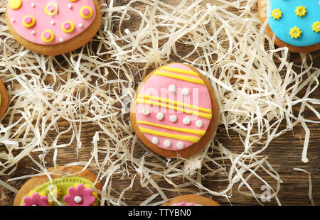Creative Easter cookies and decorations on wooden table, closeup Stock Photo