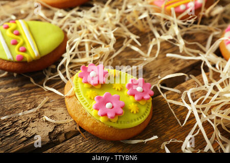 Creative Easter cookies and decorations on wooden table, closeup Stock Photo