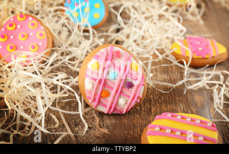 Creative Easter cookies and decorations on wooden table, closeup Stock Photo
