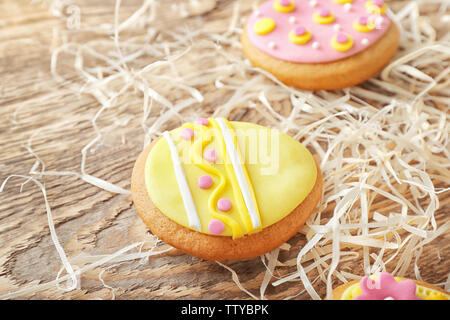Creative Easter cookies and decorations on wooden table, closeup Stock Photo