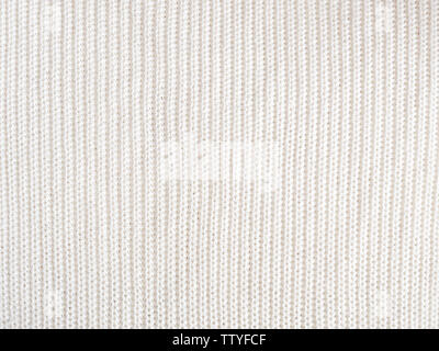 Knitted loops background. Part knitted sweater. Knitted texture. White Knitted Fabric Texture. White knitting wool texture background. Wool sweater Stock Photo