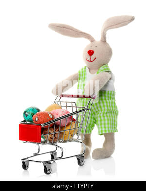 Easter bunny with eggs in shopping cart on white background Stock Photo