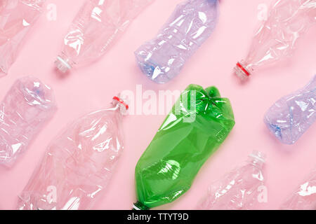 Plastic bottles on pink background top view. Plastic recycling concept. Stock Photo