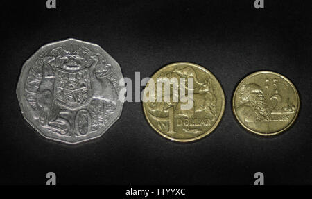 Australia 50 cents (1985-1997), 2 dollars (1999-2019) and 1 dollar (1984) Stock Photo